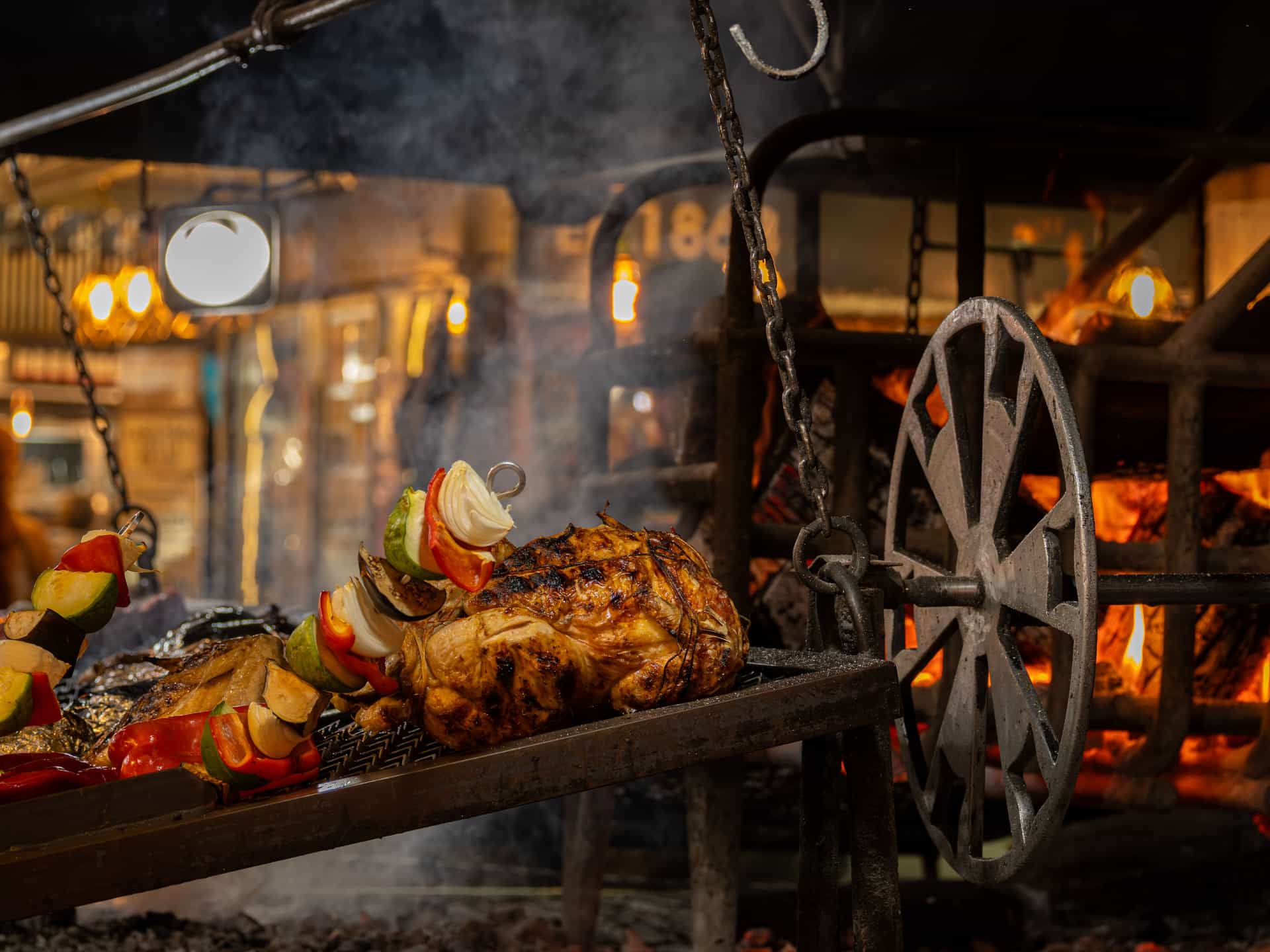 Food cooking over an open charcoal fire