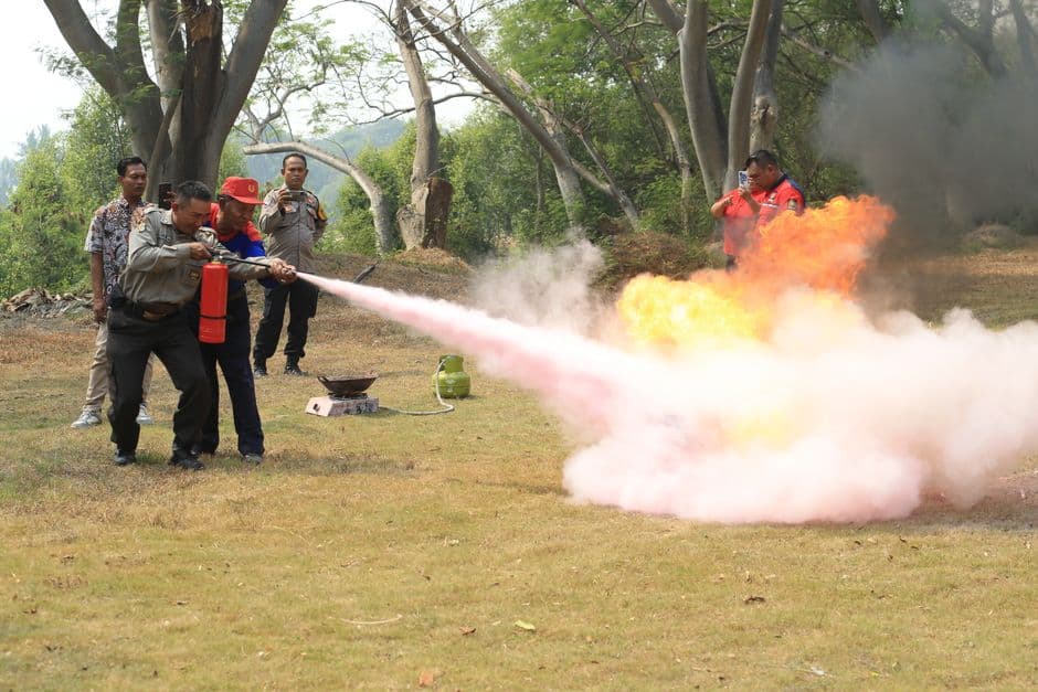 A fire extinguisher being used during a fire safety exercise